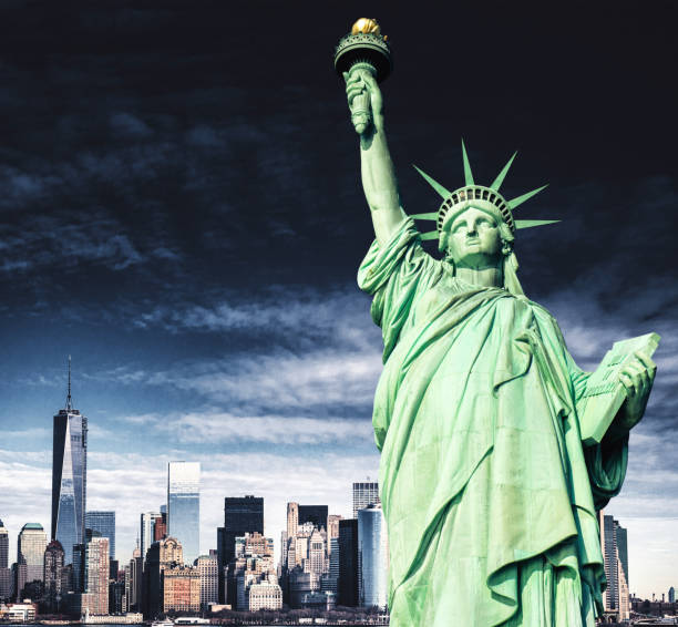 istock statue of liberty over manhattan 1087025674