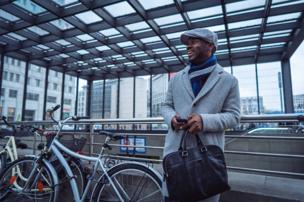 istock Businessman sending text message in the city 1087026168