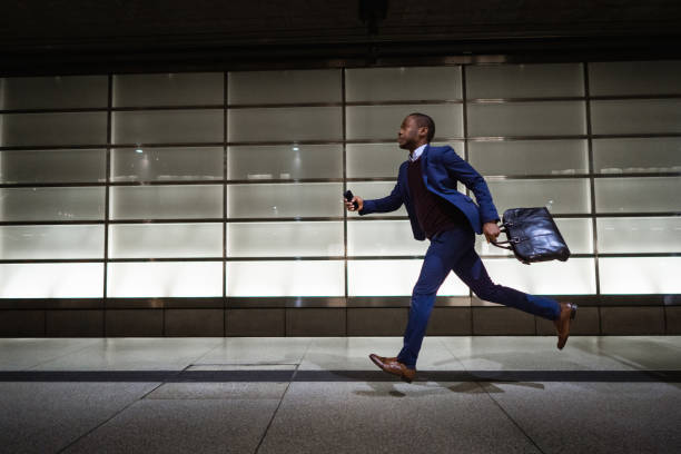 istock Businessman running at subway station 1087028414