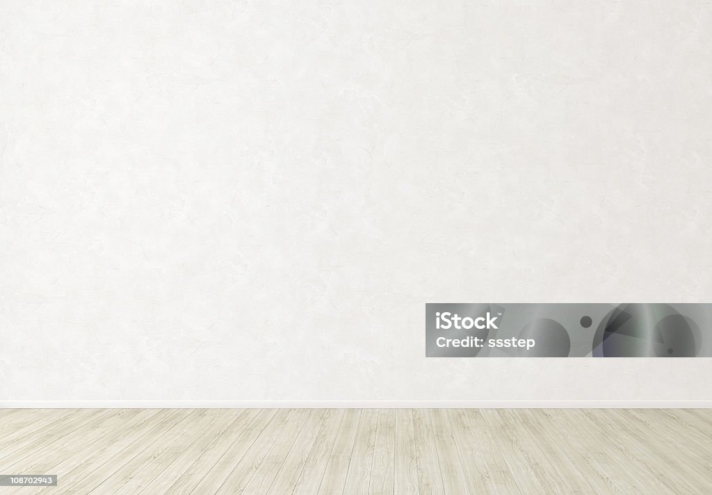 White Stucco Wall in Empty Indoor Room Background White Stucco Wall in Empty Room with Bright Wooden Floor Wall - Building Feature Stock Photo