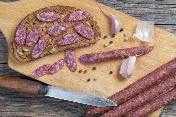 istock Thin smoked sausage, bread, garlic and pepper 1087030324