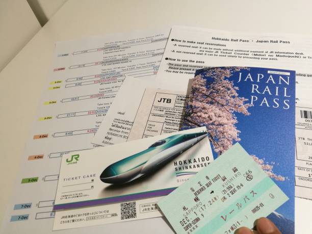Woman holding roll of tickets for sale.