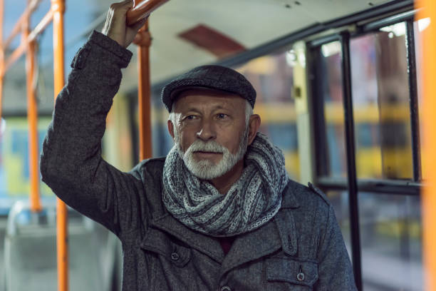 istock Mature man riding in a bus 1087030616