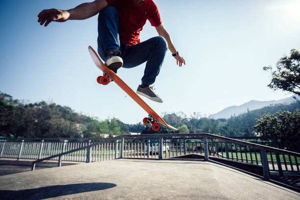 istock Skateboarder skateboarding at skatepark ramp 1087032110