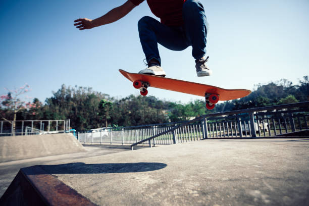 istock Skateboarder skateboarding at skatepark ramp 1087032168
