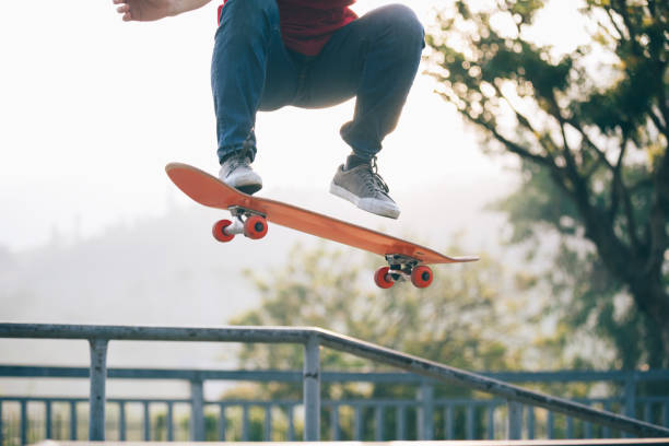 istock Skateboarder skateboarding at skatepark ramp 1087032192