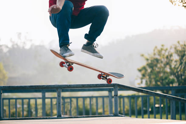 istock Skateboarder skateboarding at skatepark ramp 1087032382