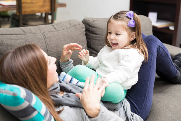 istock Girl Screaming While Playing Peekaboo With Mother 1087033062