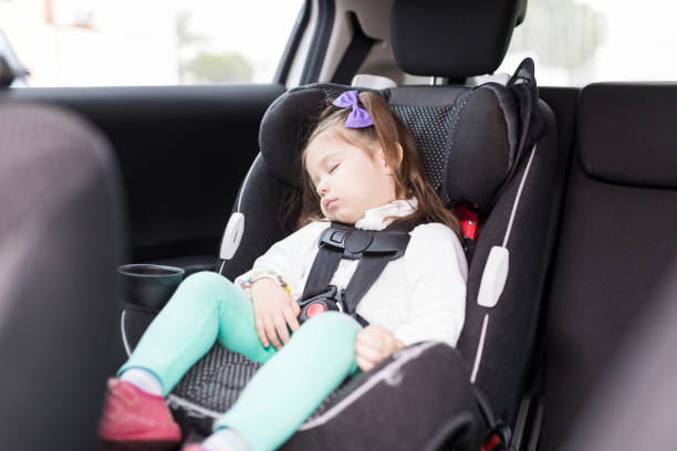 istock Girl Secured With Seat Belts Resting In Car 1087033898