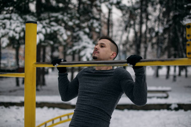 istock Young man exercising on winter day 1087039964