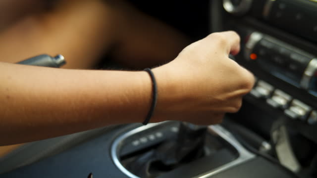 Detail of hand shifting in vehicle