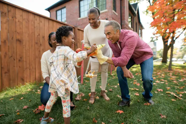 Photo of Grandparents, parent and granddaughter together