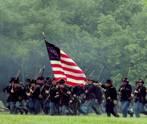 Civil War Reenactment Civil War reenactment Lakewood Forest Preserve Wauconda Illinois. Picture taken on 07/09/16. Confederate troops are charge Union troops in the battle of Antietam (Also known as Sharpsburg) originally fought on 08/27/1862 in the great state of Maryland. civil war stock pictures, royalty-free photos & images