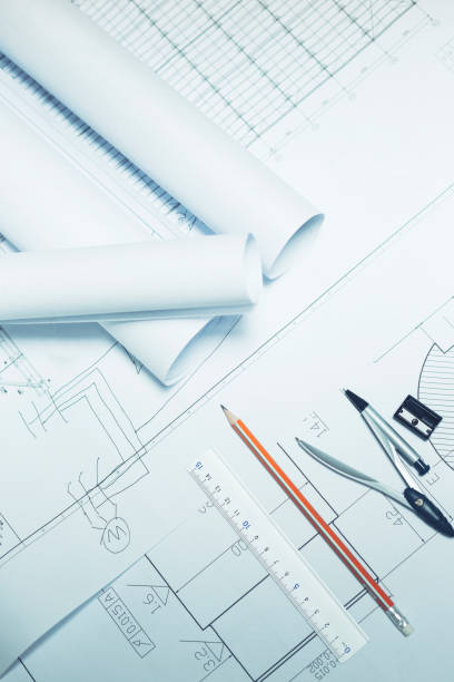 istock Blueprints and stationery on the desk. 1087068362