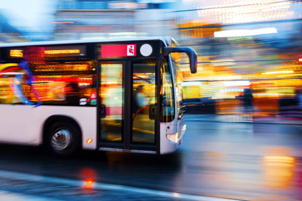 istock driving bus in the city at night 1087073094