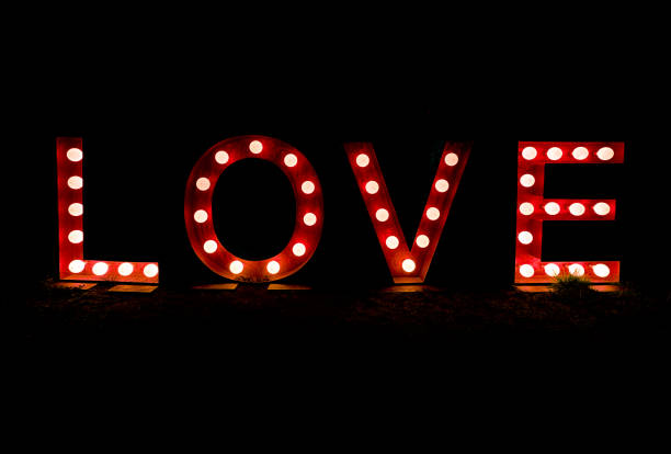 istock the word love in red letters with bright light bubls 1087076568