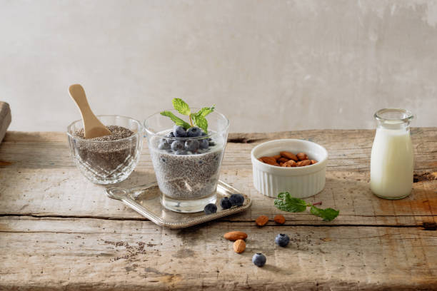 istock Healthy breakfast or morning snack with chia seeds pudding and berries on wooden rustic background, vegetarian food, diet and health concept 1087086094