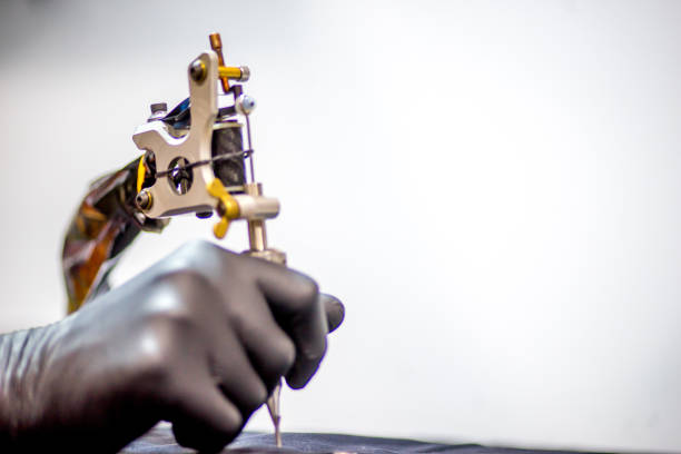 istock tattoo equipment machine and colorful ink in a workshop 1087094768