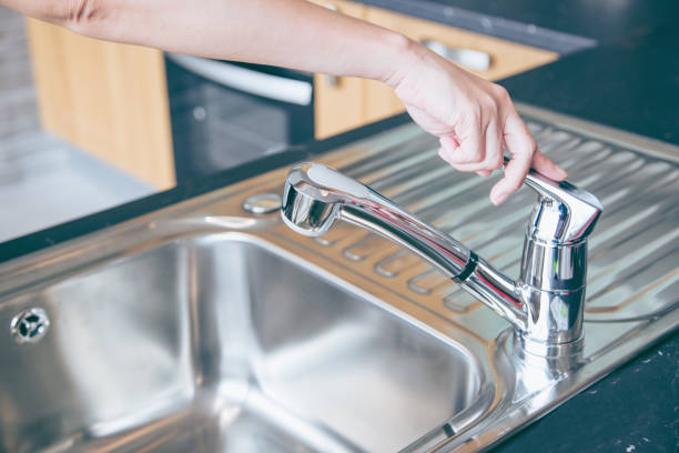 istock Hands are close faucet chrome water. 1087104206