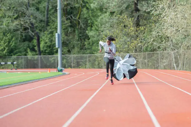 Photo of Female track athlete training at stadium