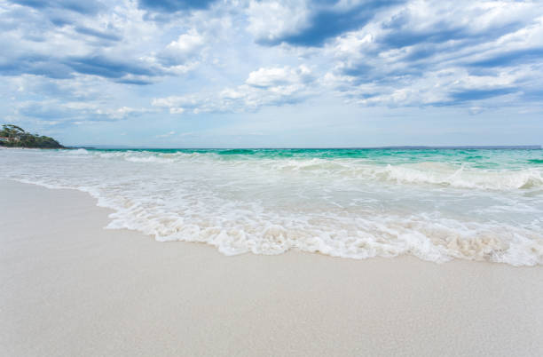 White sands of Hyams Beach Australia Hyams Beach waves wash ashore onto pristine  white sands shoalhaven stock pictures, royalty-free photos & images