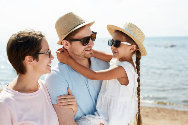 istock Modern Family Enjoying walk on Beach 1087110950