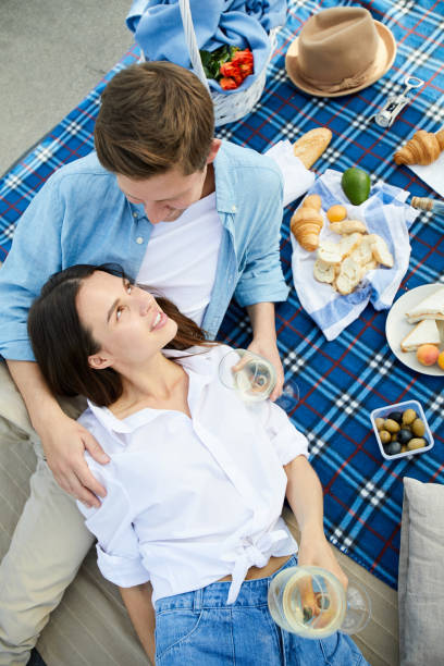 istock Romantic couple resting at picnic for two 1087113402