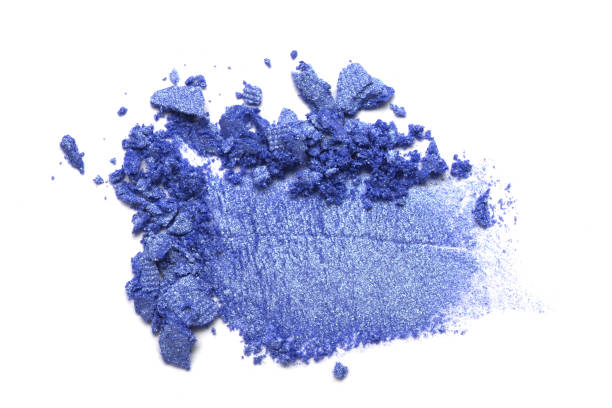 istock Eye shadow on a white background. Scattered blush sample for makeup. Blue color 1087115144