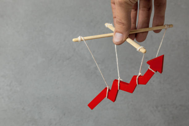 istock Manage your growth schedule. Puppeteer controls the up arrow, manipulation. Copy space for text 1087115214
