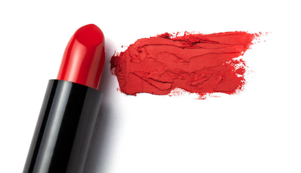 istock Red lipstick bullet smudged on white isolated. Copy space for text. 1087115342