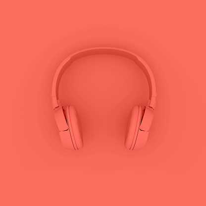 Modern Headphones trend living Coral color. Creative Design in Minimal Style. Trendy one tone monocromatic effect. 3D render Illustration.