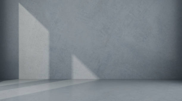 istock Abstract of empty room space with sun light cast the window shadow on the wall and floor,Perspective of minimal design architecture.3d render 1087122104