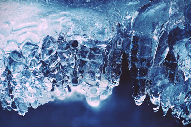 istock Mountain blue waterfall. Detail of rounded icicles 1087129062