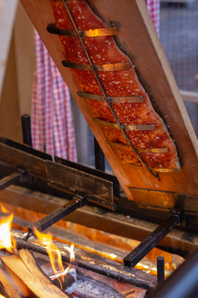 istock fish grill with open fire flame on christmas stall 1087130042