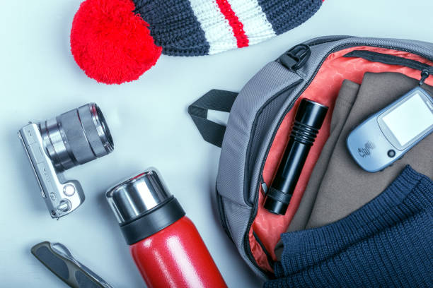 istock Tourist packing backpack for his trip. Travel concept. 1087135716