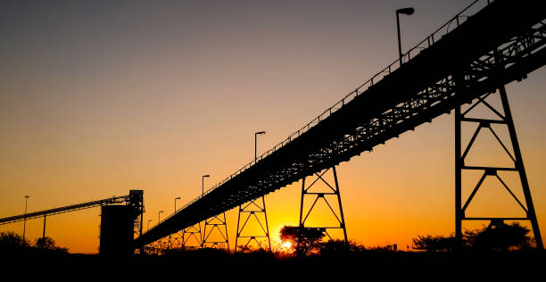 istock Silhouette of a mining silo and conveyor belts 1087145212