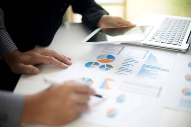 istock Business businessman work on the table use computer and tablet 1087146532