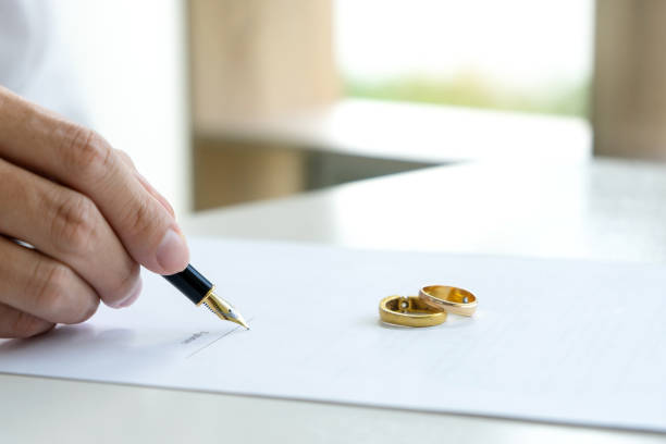 istock Hand man woman on paper with marry ring 1087146742