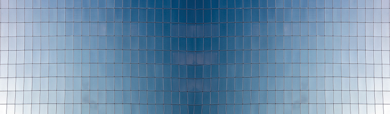 Abstract reflection of empty business office buildings in glass window in downtown urban area, Hong Kong, China