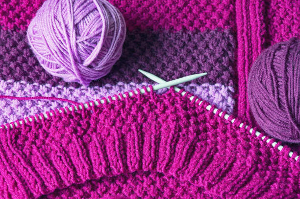 istock Balls of wool and knitting  needles 1087149852