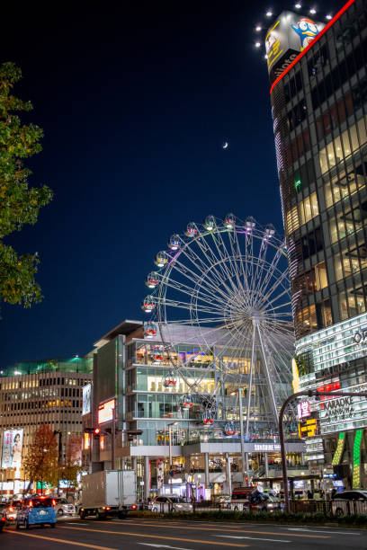 pubblicità e loghi nel centro commerciale cross sakae - ferris wheel wheel night neon light foto e immagini stock