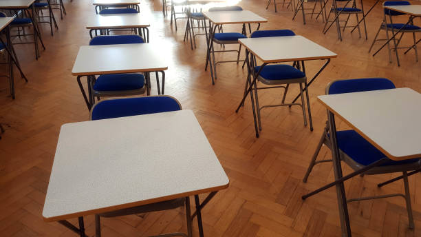 istock Exam desk in a hall 1087159998