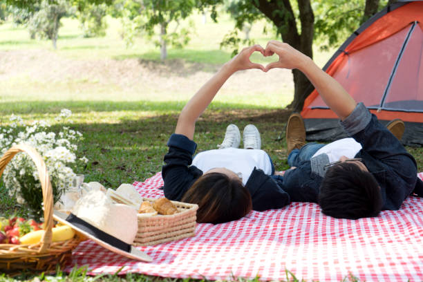 istock man woman lay on floor hand together 1087161412