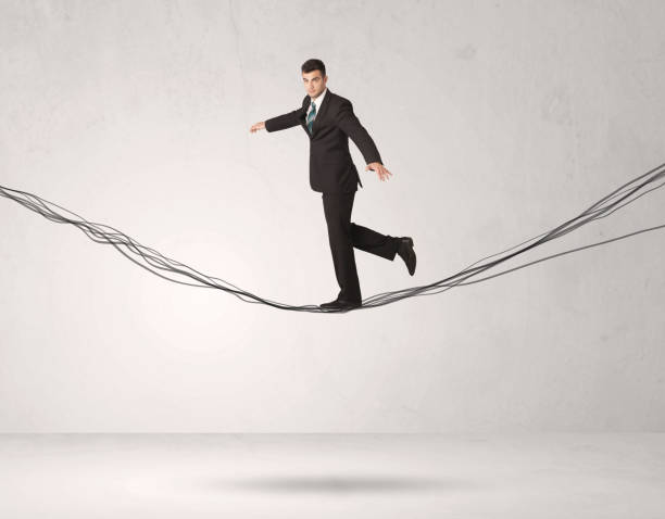 istock Sales person balancing on drawn ropes 1087162872