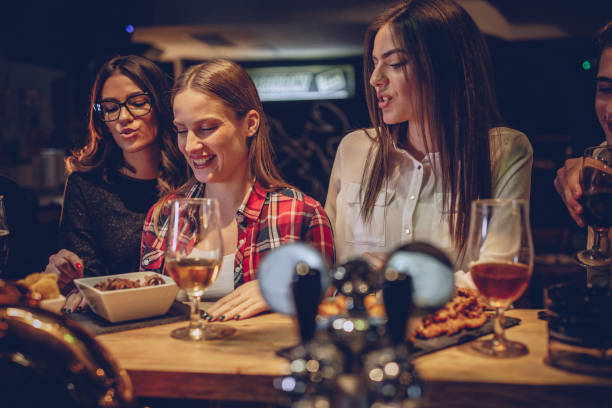 istock Friends standing together at the bar counter 1087162982
