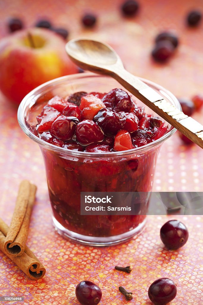 Apple and cranberry chutney Apple and cranberry chutney with spices in a jar Chutney Stock Photo
