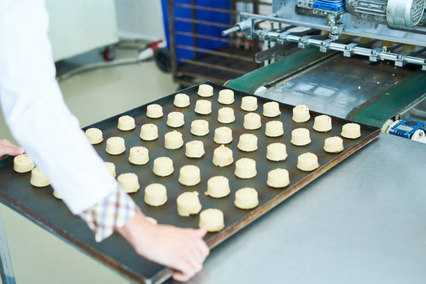 istock Confectioner holding spacing with pastries 1087171484