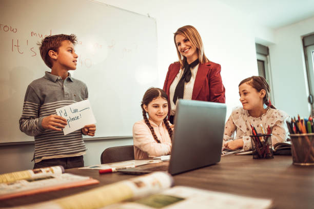 istock female teacher teaching  kids in classroom 1087172604