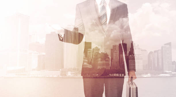 istock Businessman standing at cityscape background 1087172796
