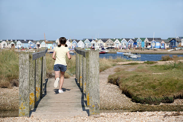 istock Young girl on foot bridge 108717424